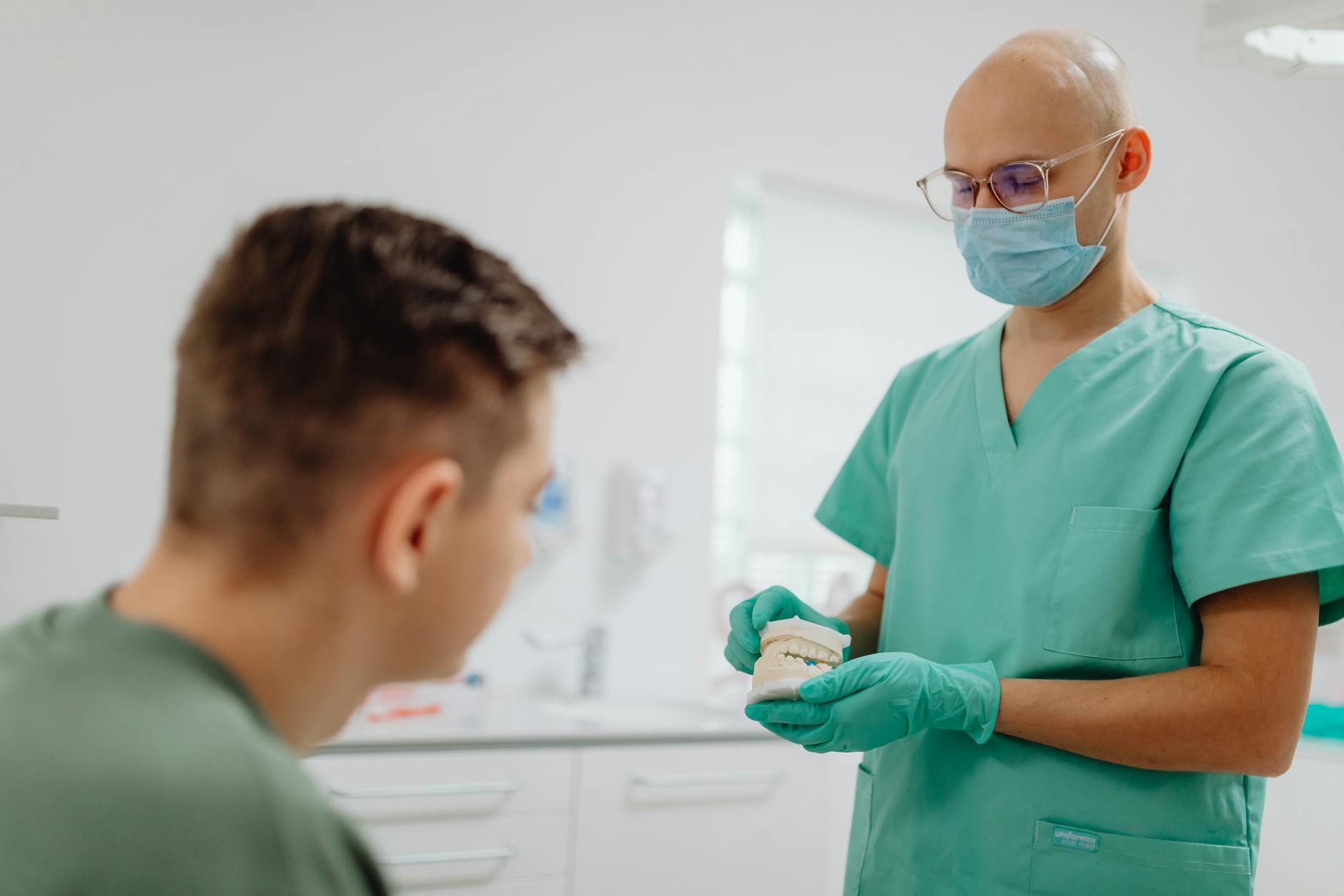 Dental implants Sector 20 Kharghar — dentist explaining implant procedure to patient at Dr. Mavleen's clinic